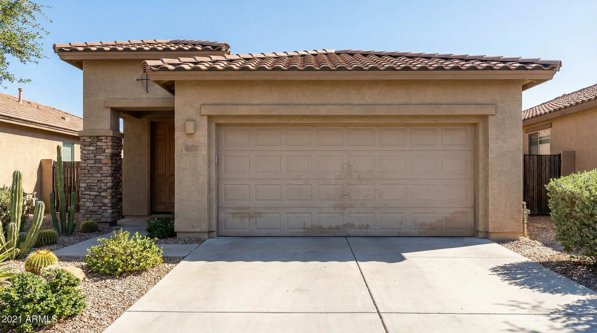 Before: faded dented beige panel door with cracked panel
